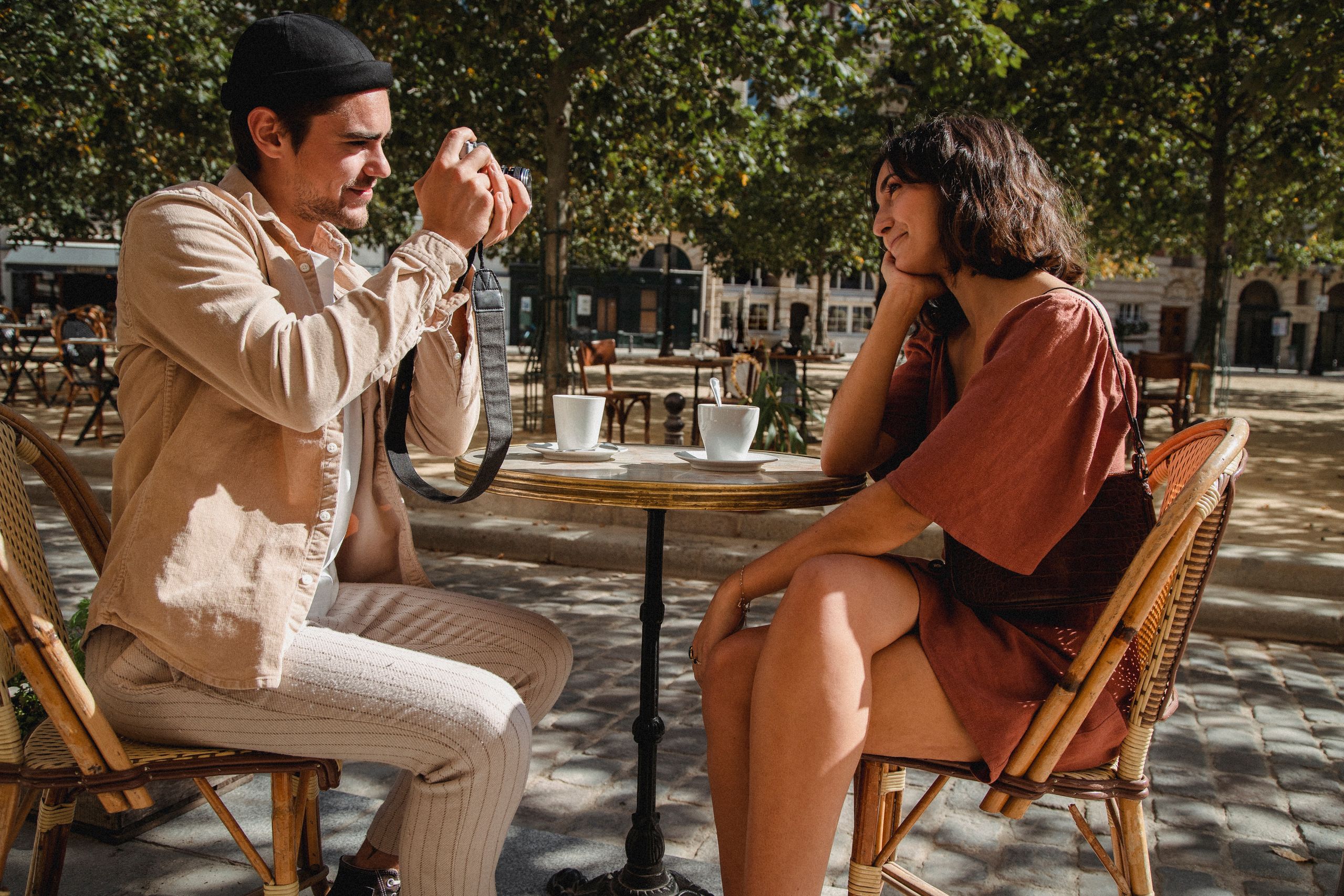 Couple sitting at cafe table